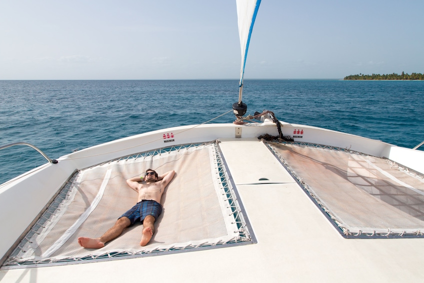 Man sunbathing on the Saona Island Catamaran Cruise