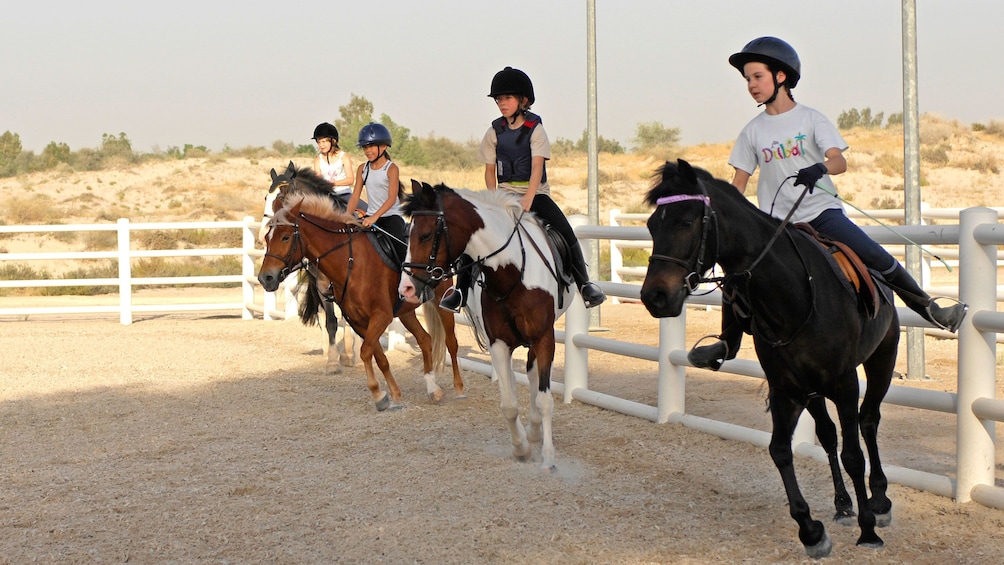 Kids on horseback in Dubai