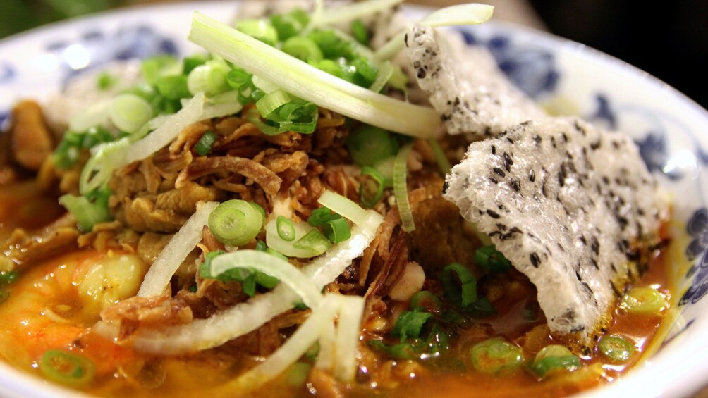 Delicious plate of soup from a street vendor in Hoi An Vietnam