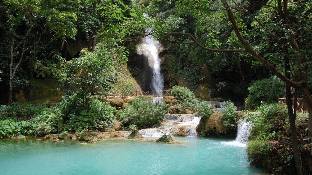 View of the Kuang Si Falls from a turquoise blue pool