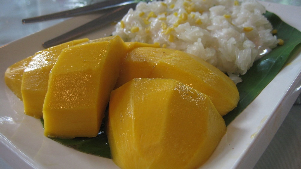 mango and rice on plate