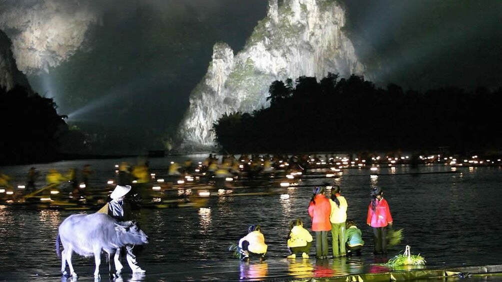 performing at night with natural backdrop in Guilin