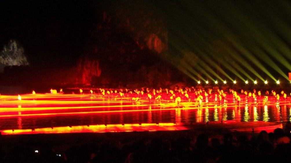 performers immersed in dazzling light show in Guilin