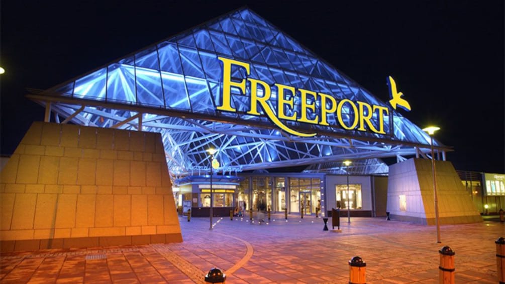the Freeport shopping center at night in Lisbon