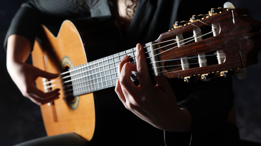 man playing Flamenco style on guitar in Barcelona