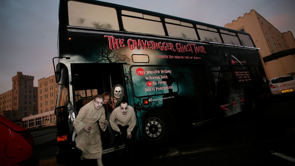 men dressed as ghouls on a tour bus in Dublin