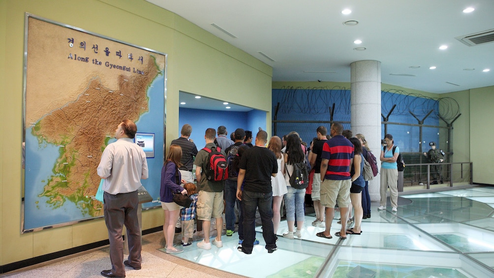 tour group observing map in seoul