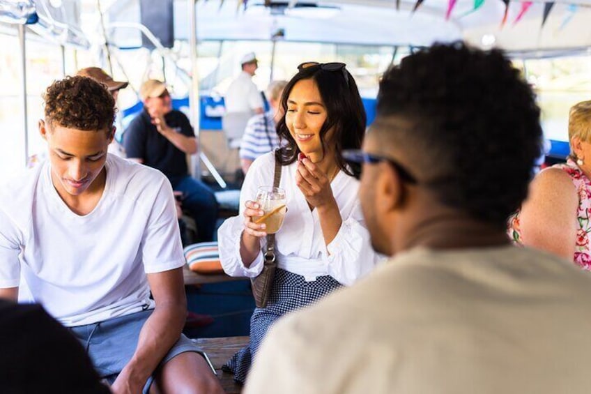 Customers enjoying the SA drinks for sale on board