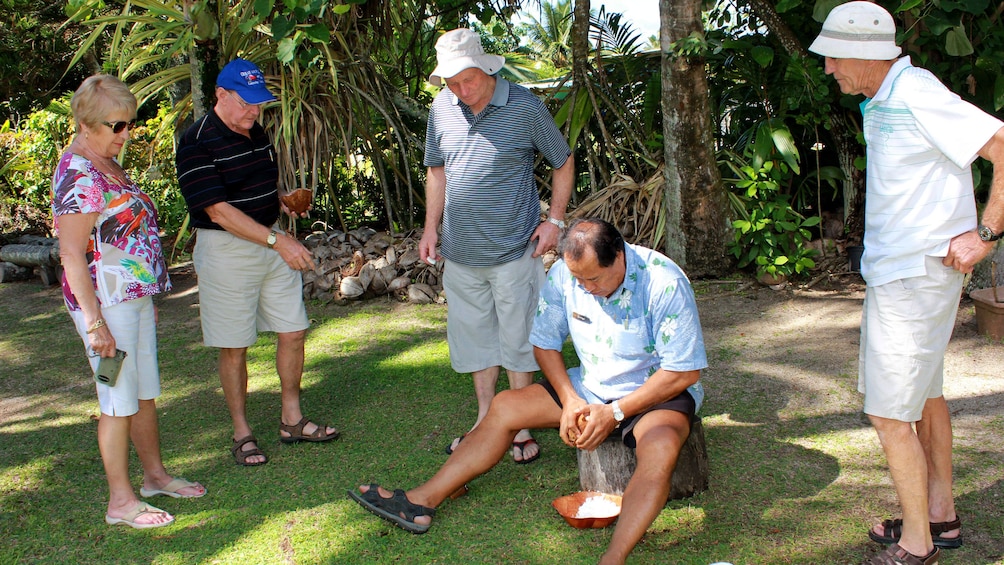 People in yard in Cook islands