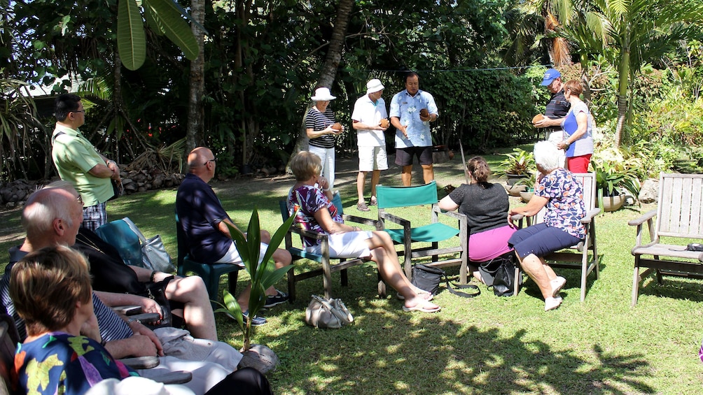 People in yard in Cook islands