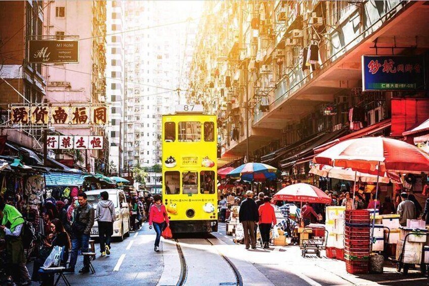 Tramway through a lively local market