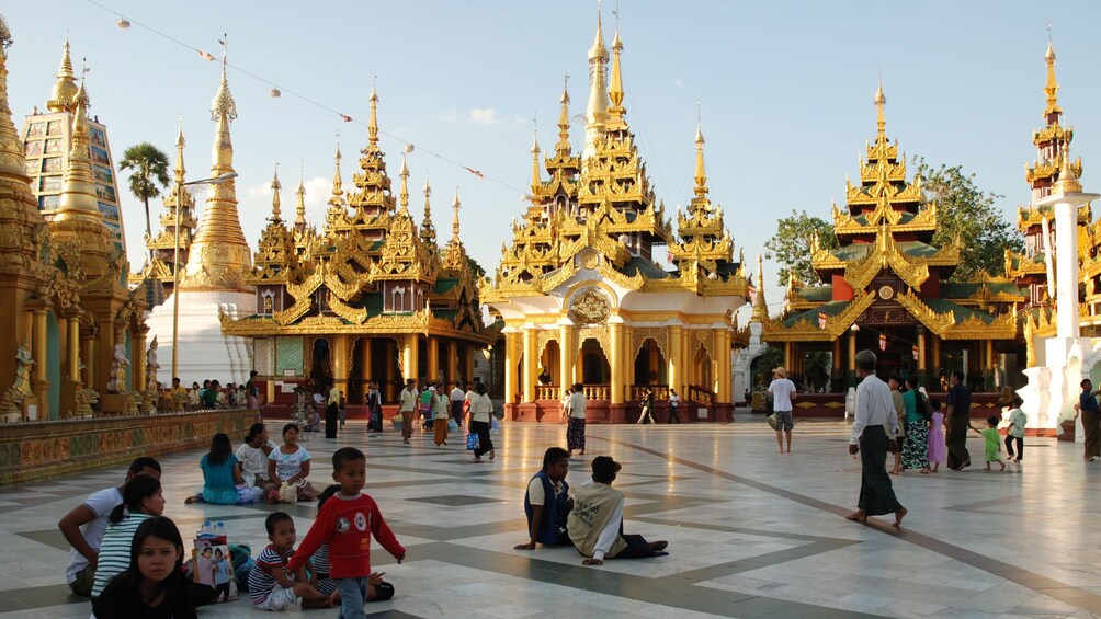 People walking in the pavilion of Shwedagon Pagoda  in Yangon