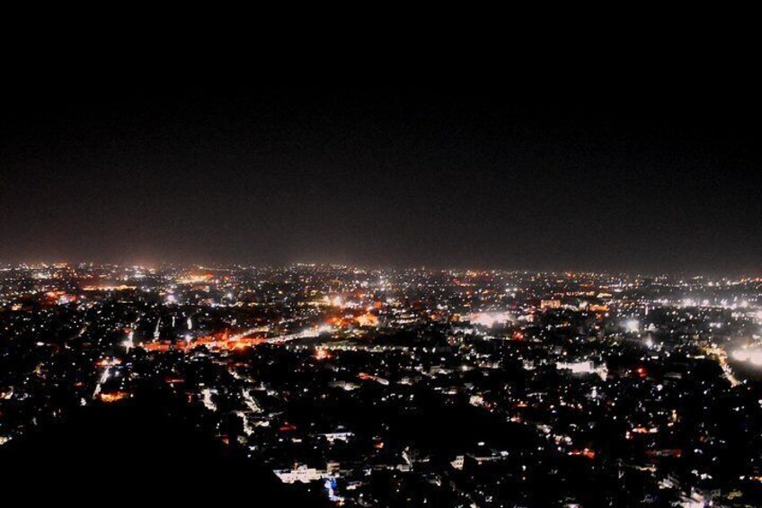 Birds eye view of Jaipur from a Hill top restaurant. the mesmerizing sunset and Lighting up of jaipur is spectacular.