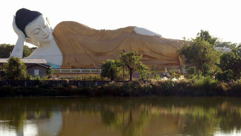 Large scale reclining Buddha along the river bank in Bago