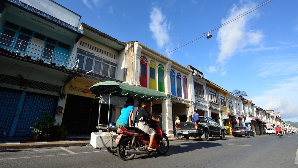 Couple riding a scooter in Phuket