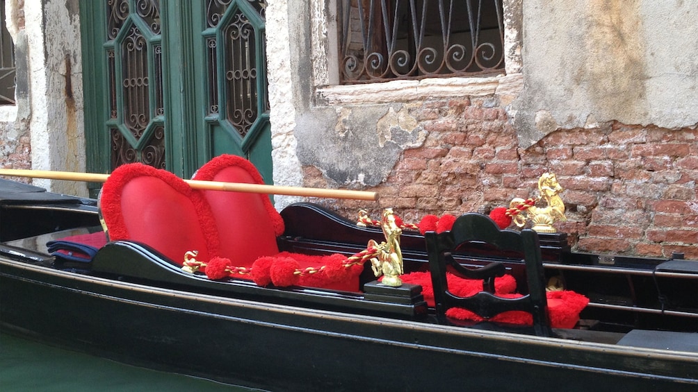 Gondola with heart pillow in Venice Italy