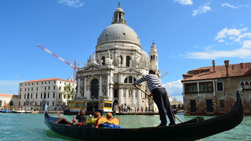 Gondola in front of the Santa Maria della Salute Basilica in Venice, Italy