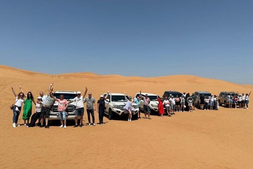 Abu Dhabi: 7-Hours Desert Safari with BBQ, Camel Ride & Sandboarding