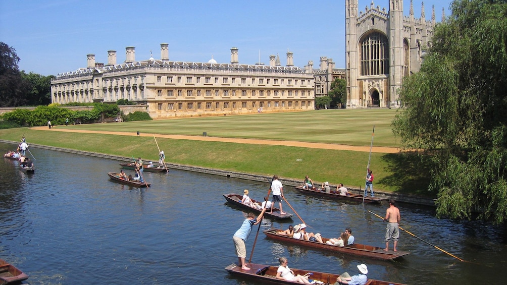 many people on the river rowing boats at Cambridge University in England