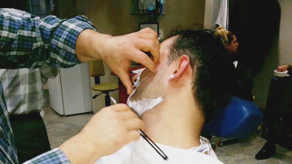 Man getting a traditional Turkish shave in Istanbul 