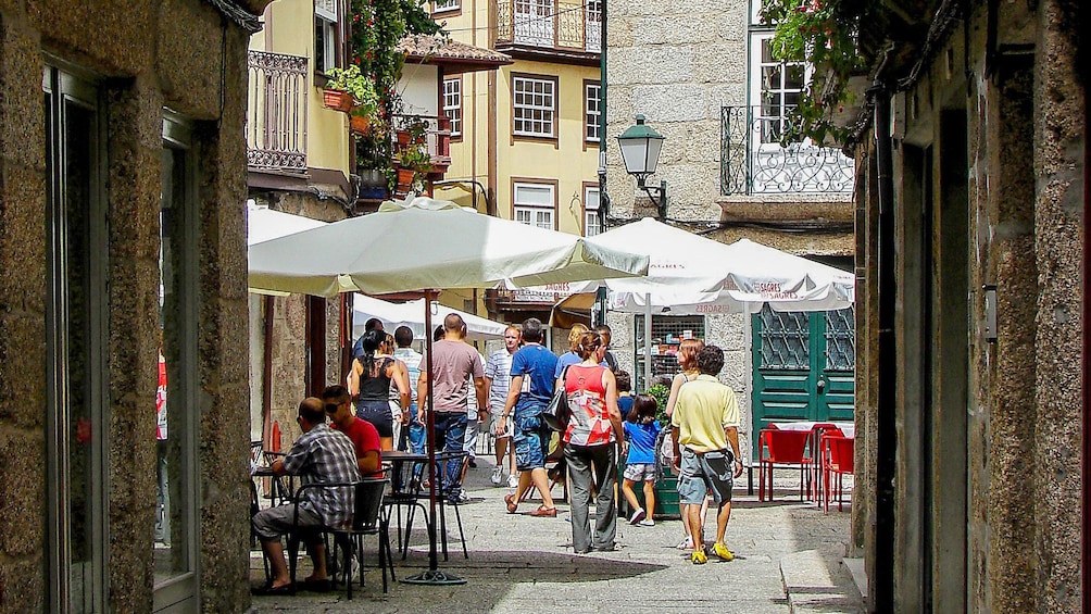 Cafes offering outside dining on the cobblestone walkways in Braga