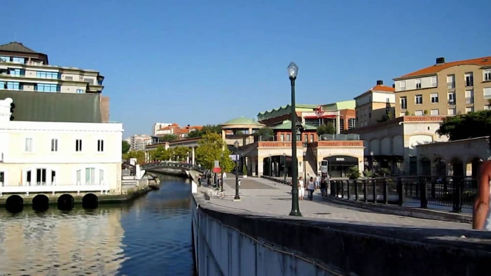 People walking along a canal in Aveiro