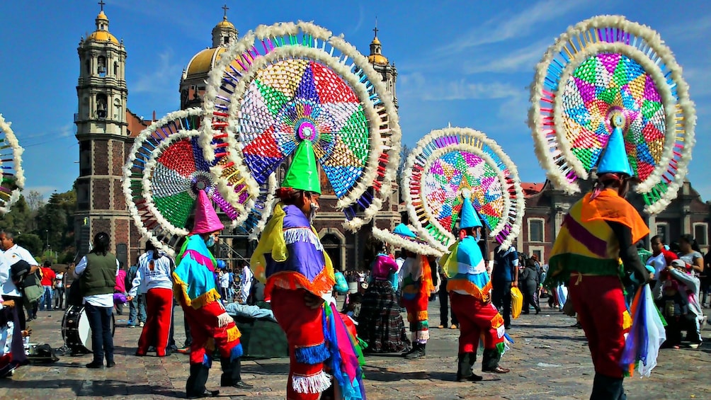 colorful performers outside the Guadalupe shrine