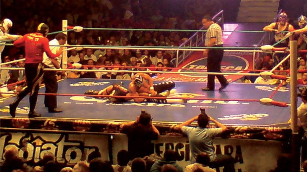 Two lucha libre fighters in the ring