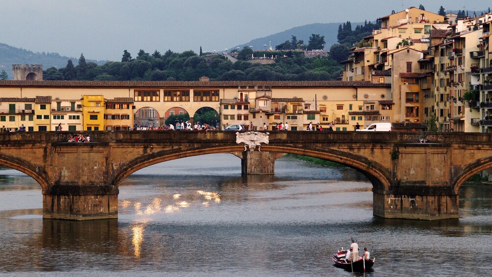 Canal view and bridge on Florence boat tour in Italy