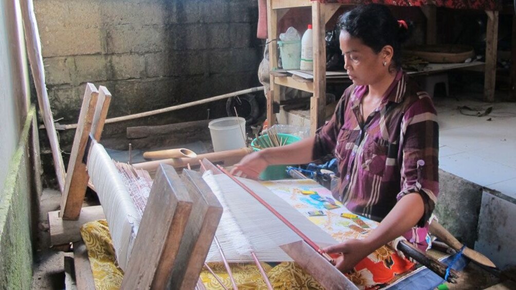 A woman at a loom in Bali
