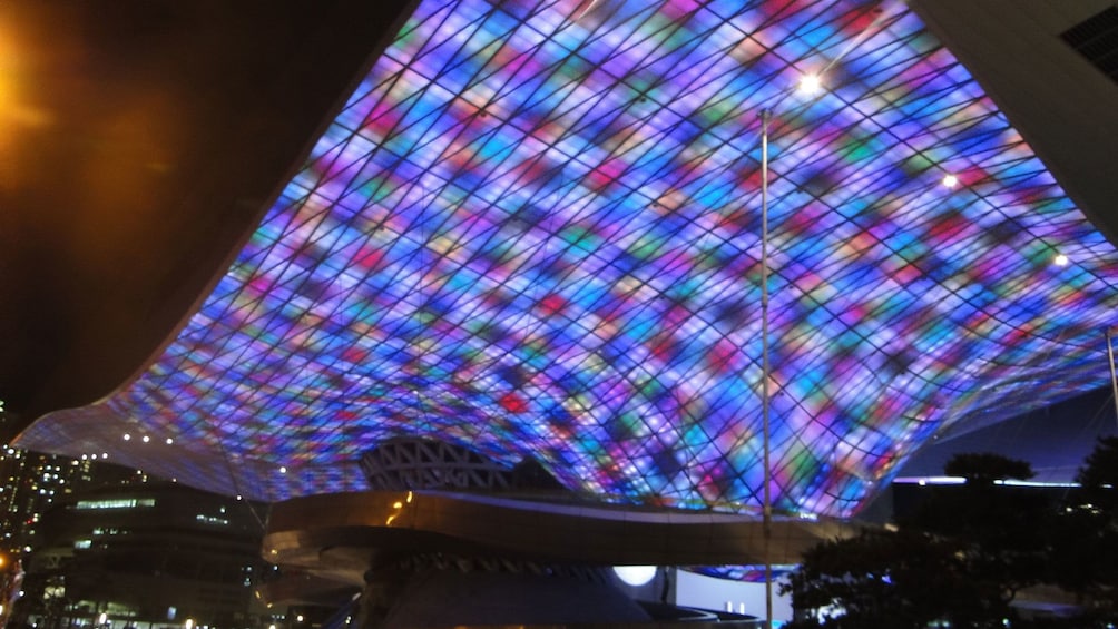 Night view of a building with lights shining on the ceiling in Busan at night 