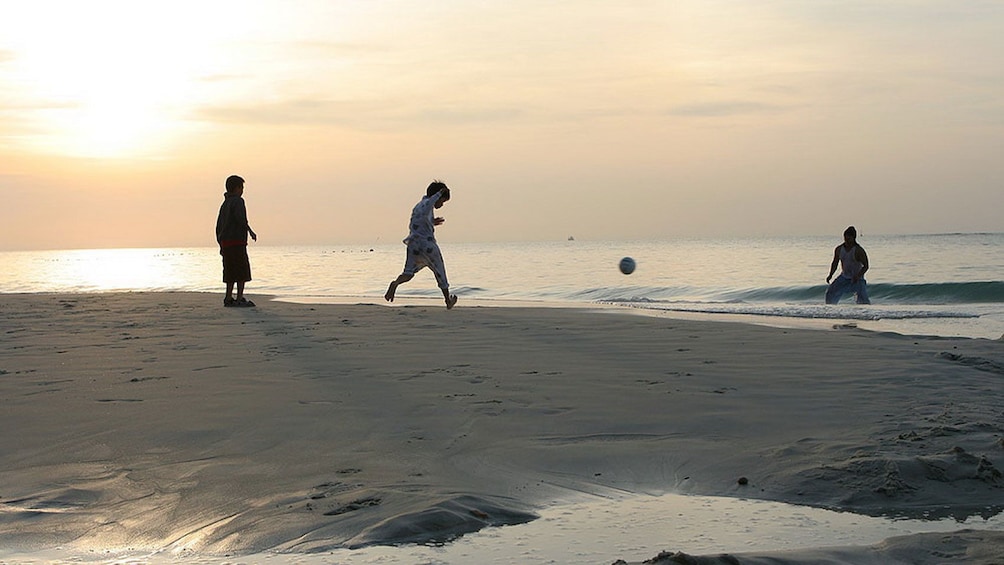 Children playing ball at the Samet Island in Pattaya