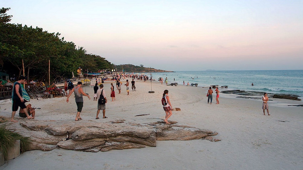 Beach goers enjoying the sunset in Pattaya