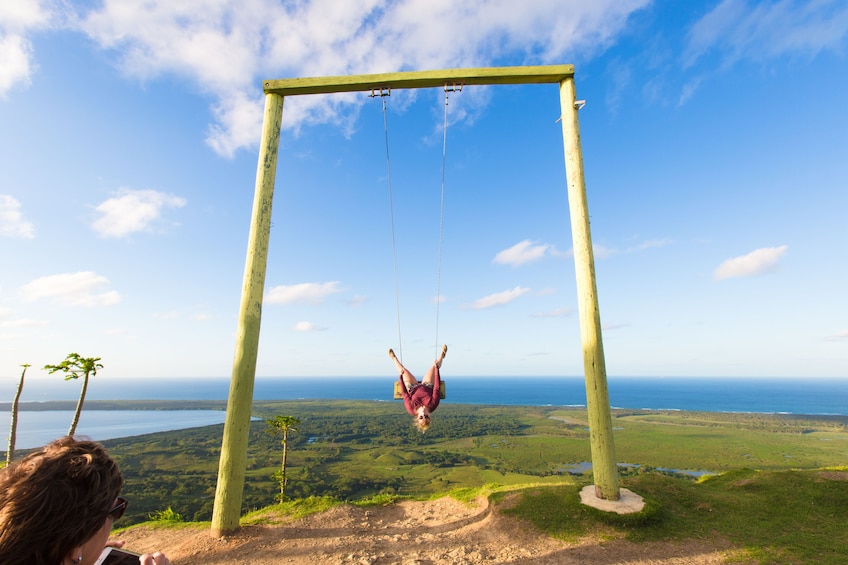 Woman on swing on Montaña Redonda the Dominican Republic
