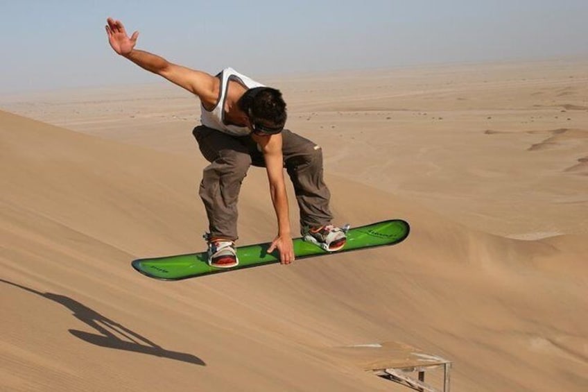 Enjoy an optional activity and try sandboarding on the dunes at Swakopmund