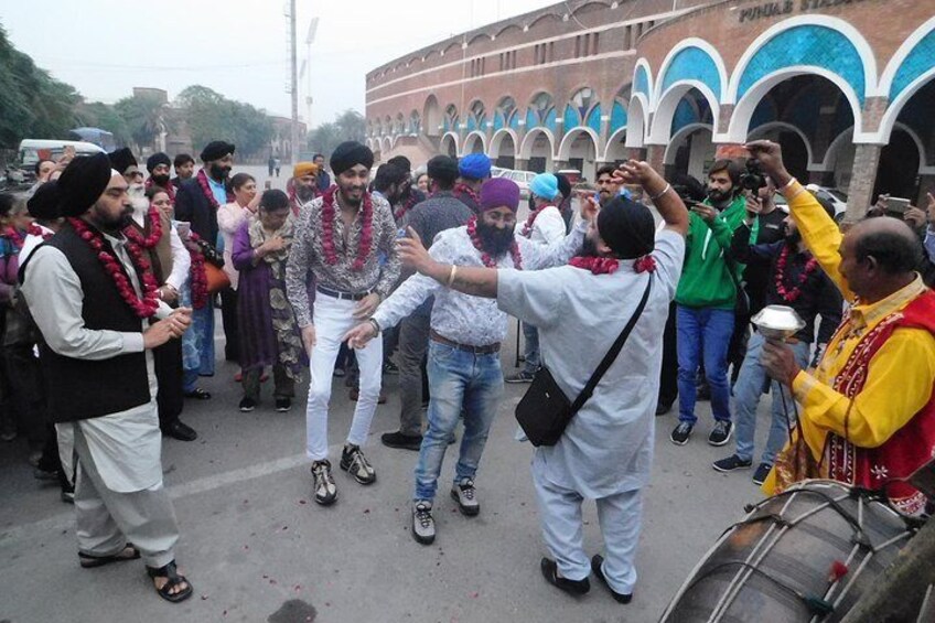 Sikh Tourist Dancing in Traditional Way (Banghra)