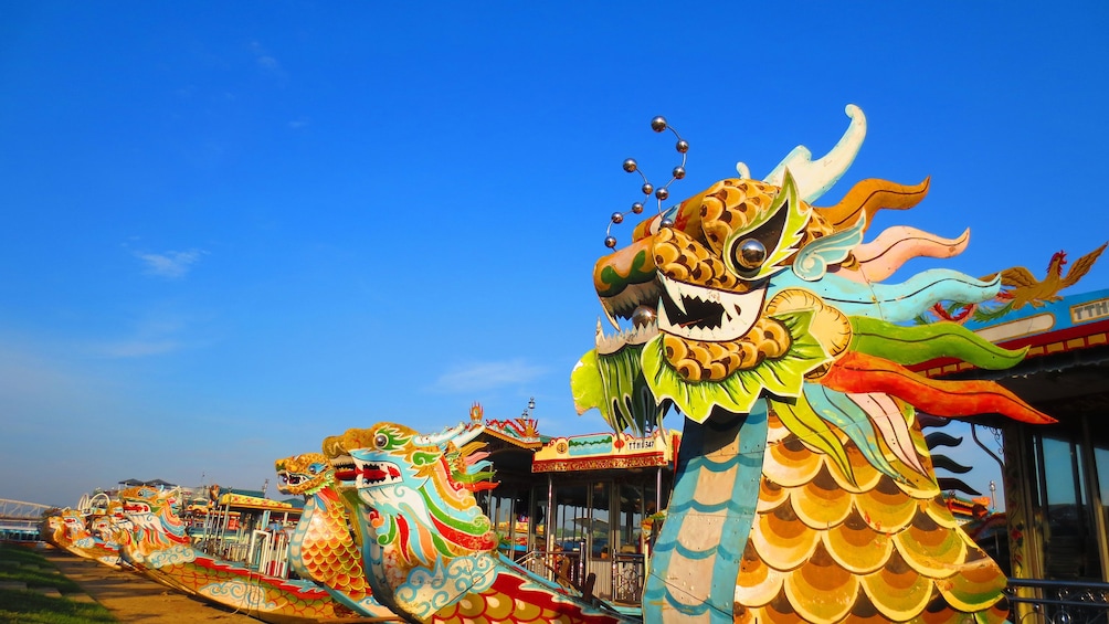 Colorful dragon boats docked in Hue
