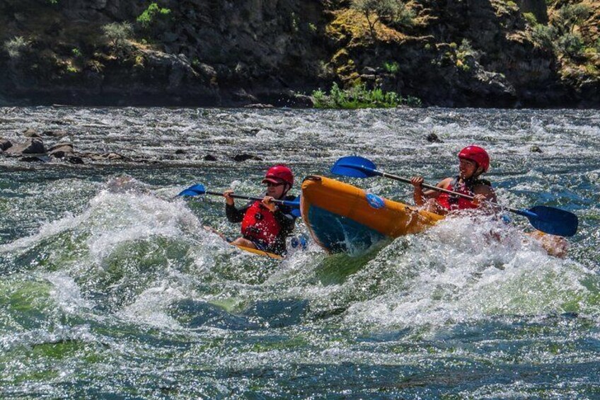 Friends learning to inflatable kayaks.