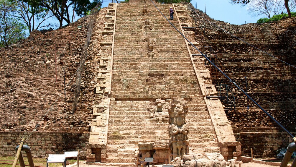Person on stairs on temple in Copán ruins