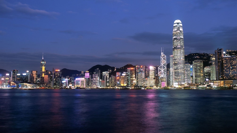Tampilkan item 5 dari 10. City lights reflected in the water in Hong Kong
