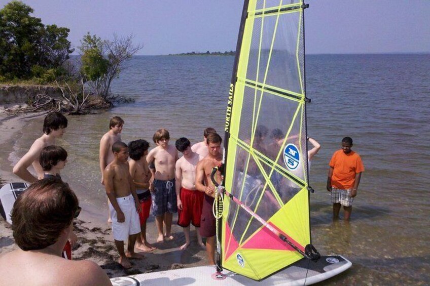 Boy Scouts learn about the sail components of a Windsurfing Rig.