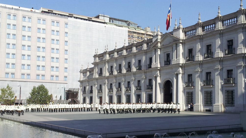 Palacio de La Moneda with soldiers marching in Santiago