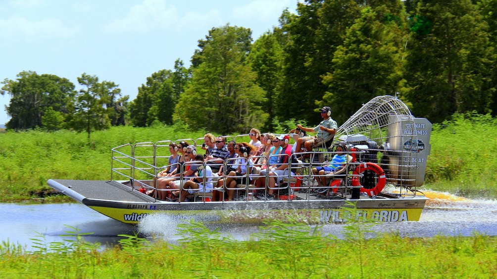 Show item 1 of 8. Airboat with group in the Everglades in Orlando.