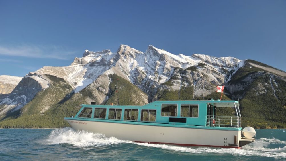 Explore Lake Louise via tour boat and enjoy scenic views of the Canadian Rockies