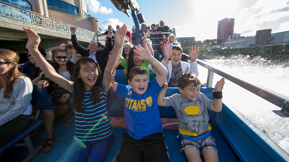 Harbour Hopper riders with hands in the air