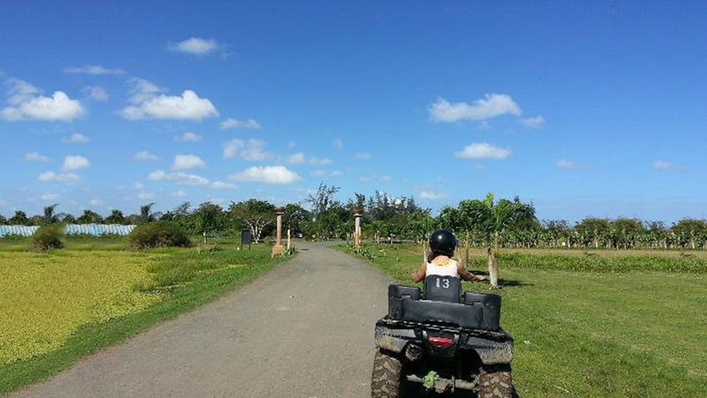 Single ATV rider on trail