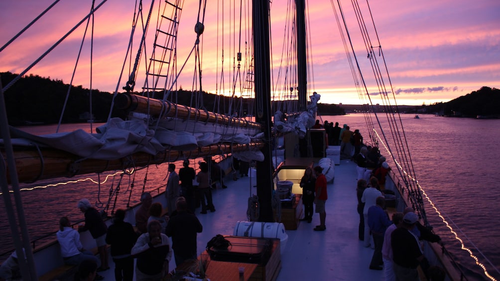 Tall Ship Silva deck with people at dusk
