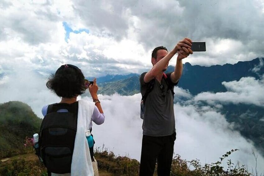Taking photo on the top mountain