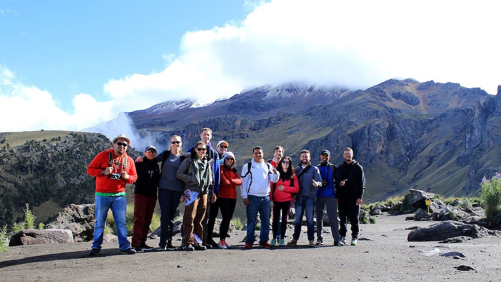 Group standing in front of mountain range in Mexico