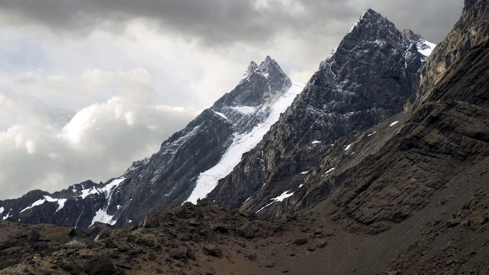 The sharp snow dusted peaks of the andes mountains 